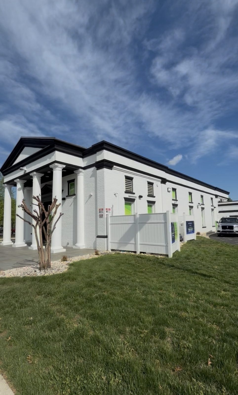 Green Point dispensary exterior, the white columned building in Edgewater